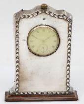 A silver fronted and oak mantel clock, Birmingham 1913, with wheatsheaf border, with Vertex pocket