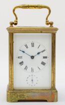 A 20th century brass corniche cased hourly striking alarm carriage clock, the white dial with