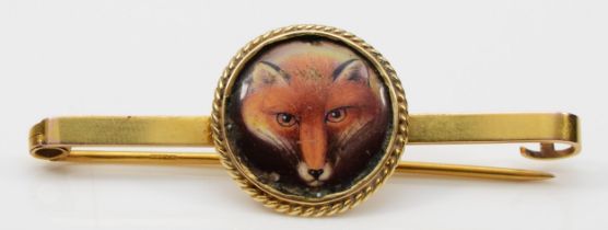 A Victorian gold painted ceramic fox head pin, probably by William Essex, unsigned, later adapted