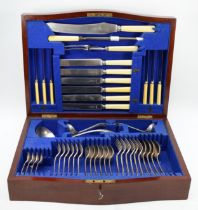 An Edwardian inlaid serpentine fronted part canteen of electroplated Old English pattern flatware