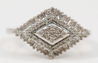 A 9ct white gold diamond cluster ring, the rhombus shaped setting set with baguette cut and eight