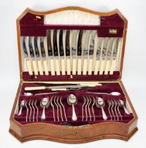 A 20th century walnut cased serpentine fronted 'King Henry' canteen of plated flatware for eight