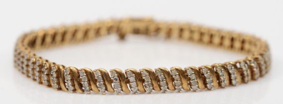 A vintage 9ct gold eight cut diamond bracelet, four rows of diamonds to each section,