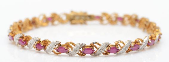 A 9ct gold, single cut diamond and navette cut ruby line bracelet, 18.5cm, 9.5gm