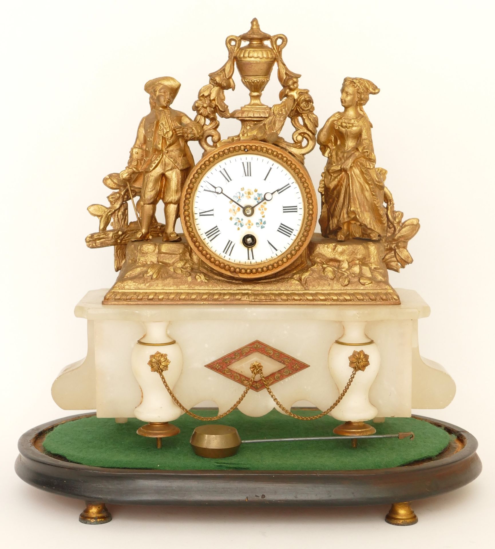A late 19th century French gilt metal and marble drumhead mantle clock, surmounted with a man and