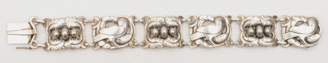 K. Mohl Hansen for Georg Jensen, a silver 6 link bracelet with dove and foliage motifs with silver