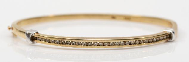 A 375 gold brilliant cut diamond hinged bangle, approximately twenty nine channel set diamonds
