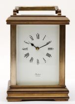 Huber of London; a brass corniche cased striking carriage clock, with reeded corners, striking on