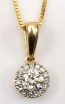 A 10k gold brilliant cut diamond pendant, surrounded by smaller eight cut diamonds, central stone
