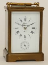 Rapport, a 20th century French brass corniche cased striking alarm carriage clock, the white dial
