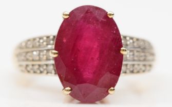 A 9ct gold glass filled ruby cocktail dress ring, with eight cut diamond set shoulders, O, 3.9gm.