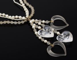 A vintage Miriam Haskell three strand glass bead and faux pearl necklace, with acrylic heart