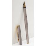 Mont Blanc, a brushed stainless steel cartridge fountain pen with 585 gold nib.