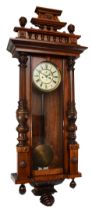 Gustav Becker, a 19th century walnut cased two weight Vienna wall clock, the glass door opening to