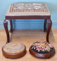 An early 20th century mahogany framed stool with embroidered tapestry stuff over seat, raised on