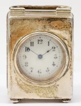 A Victorian silver miniature clock, London 1898, in plain case, raised on four ball feet, C scroll
