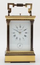 A 20th century French brass corniche cased half hourly repeater striking carriage clock, the white