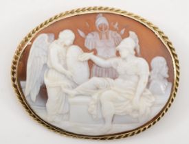 An early 20th century 9ct gold shell carved cameo brooch, depicting Athena painting with an angel