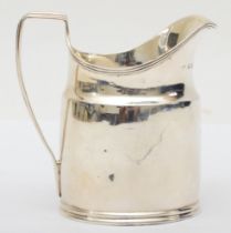 A George III silver plain cream jug, makers mark worn, London 1797, with reeded border and handle,