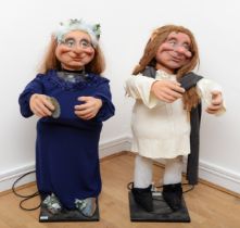 A husband and wife troll automatons, with moving resin heads and arms, 95cm. (2) In working order.