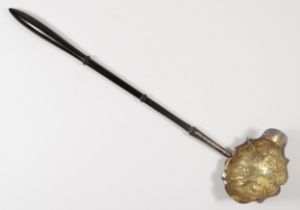 A George III silver punch ladle, marks poorly struck, the embossed bowl with lip, turned hardwood