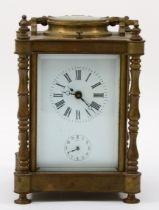 A 20th century brass corniche cased quarterly striking and repeating alarm carriage clock, with