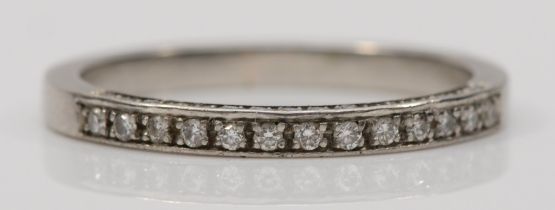 A platinum brilliant cut diamond half eternity ring, with diamonds set to the side, Q, 4gm.