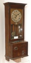 Gledhill Brook Time Recorders LTD, an early 20th century oak cased clocking in machine, the 9"