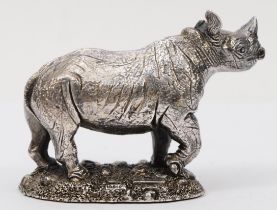 A silver rhinoceros paperweight, by Country Artists, Birmingham 1992, loaded, 6 x 8.5 cm.