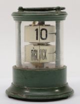 A 20th century flip ticket clock, in a green painted tin and glass cylindrical and glass case,