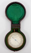 An early 20th century gilt metal cased compensated pocket barometer, inscribed and dated 1909, in