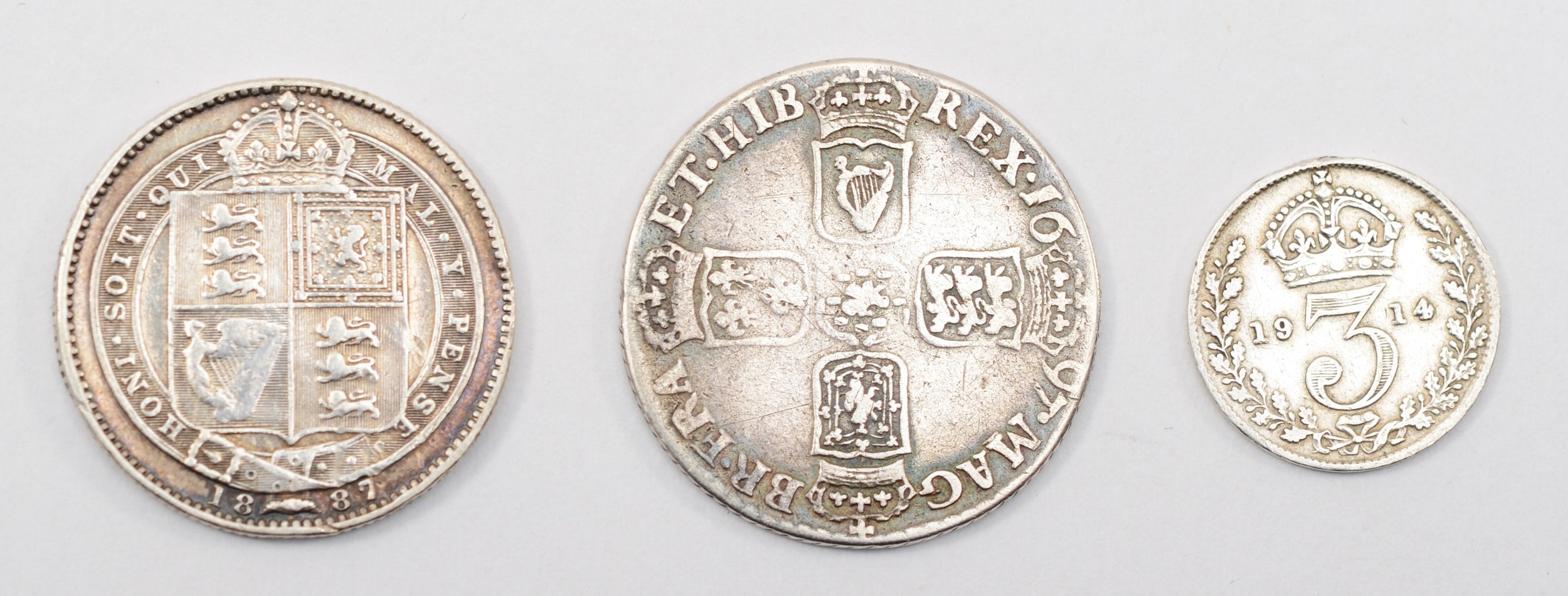 A William III silver shilling, 1697, first bust, Mint mark B bottom left, 25mm, 5.5gm, together with - Bild 2 aus 2