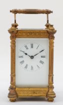 A 20th century French brass corniche cased carriage clock, the white dial with black Roman numerals,