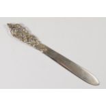 A Scandinavian 830 silver letter opener, with cast floral handle, inscribed Island20cm, 51gm