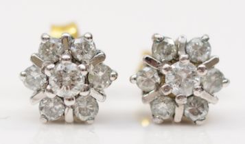 A pair of 9ct white gold brilliant cut diamond floral cluster stud earrings, 7mm, 1.6gm.