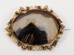 A Victorian gold mounted agate brooch, with chased scroll border, unmarked, 58 x 42mm, 18gm, base