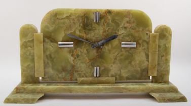 A large Art Deco mottled green onyx mantleclock, with chrome plated baton numerals and hands, raised