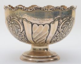 An Edwardian silver presentation rose bowl, by Deakin Bros., Chester 1903, embossed and chased