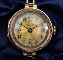 A 9ct gold cased ladies wrist watch, by James Walker, London, the silvered dial set with Arabic