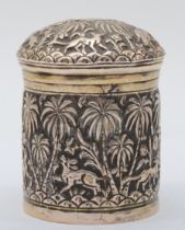 An Indian silver lidded jar, embossed and chased with animals amongst palm trees, 8.5 x 6cm, 89gm