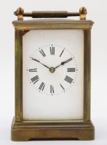 A 20th century French brass corniche cased half hour striking carriage clock, the white dial with