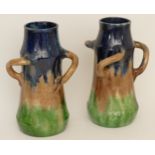 A pair of early 20th century possibly Belgian drip glaze vases in blue, brown and green with three