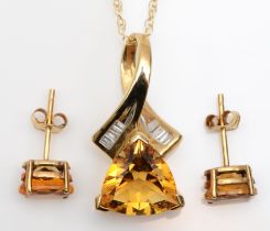 A 9ct gold, triangular citrine, 11 x 11 x 11mm, and baguette diamond pendant, 23mm overall,