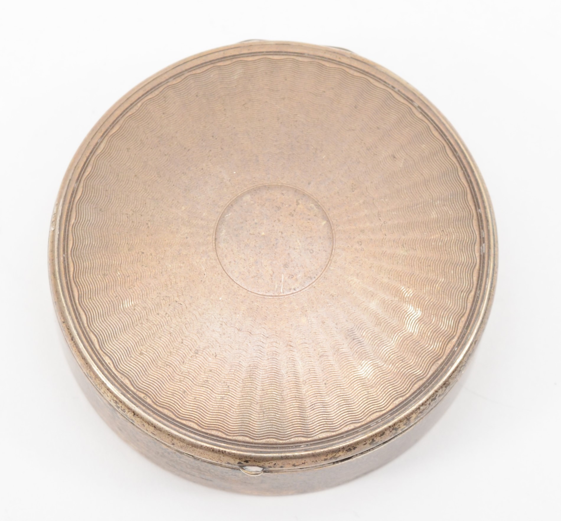 An Art Deco silver powder compact box, Birmingham 1927, with engine turned cover, opening to