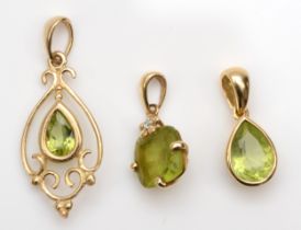 An 18ct gold pear cut peridot pendant, 14mm, .8gm, together with a 375 gold square cut peridot