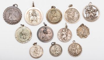 A group of silver St Christopher charms to include two Georg Jensen examples, 57gm.