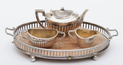 An Edwardian miniature silver three piece tea set and tray, by Levi & Salaman, Birmingham 1905,