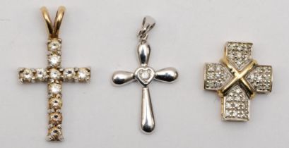 A 9ct gold eight cut diamond cross pendant, with central cross, 13 x 11mm, a white gold single