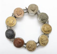 A Victorian silver carved lava cameo sectioned bracelet, decorated with nine female busts in