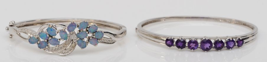 A silver triplet opal set hinged bangle, 60mm, together with a silver amethyst bangle, 35gm.